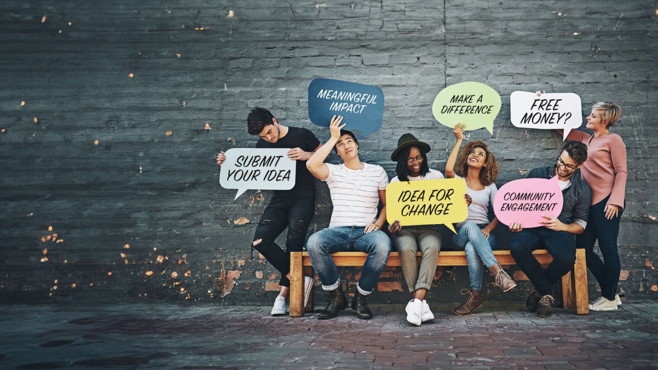 Students holding speech bubbles