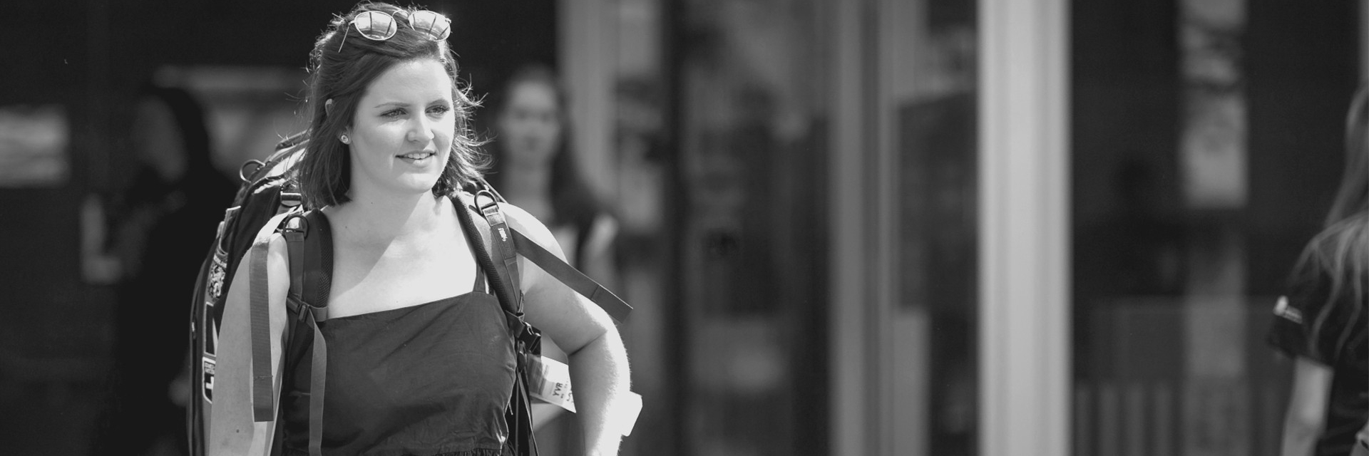 SFU resident moving in, carrying her luggage to her new building