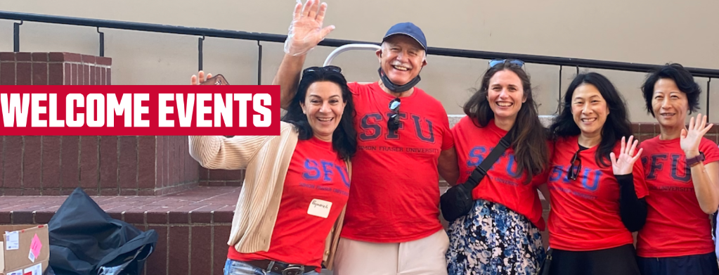 A group of staff members wearing red SFU t-shirts, smiling and waving at the 2023 SFU Vancouver Welcome Back Community BBQ