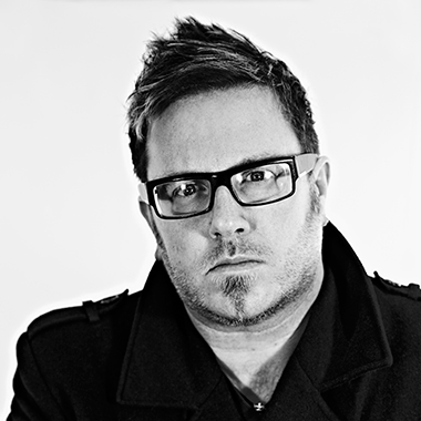 Black and white headshot of Fit To A Tee's prepress lead, Chris Anthemum.