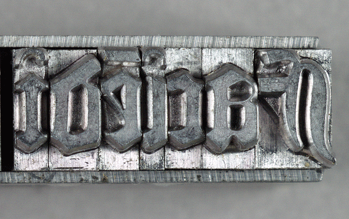 Several letters of Gutenberg's type, cast in metal.