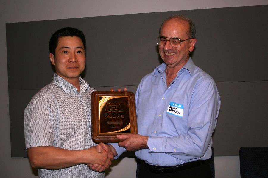 Troy Kimoto accepting award from John Border on behalf of Shane Sela, 2011