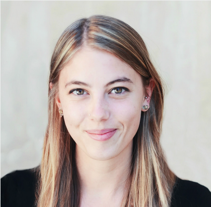 photo of skye vallance smiling with gray backdrop