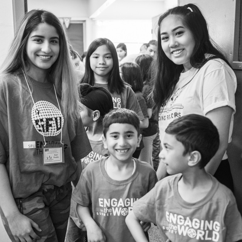 Volunteers and students posing happily