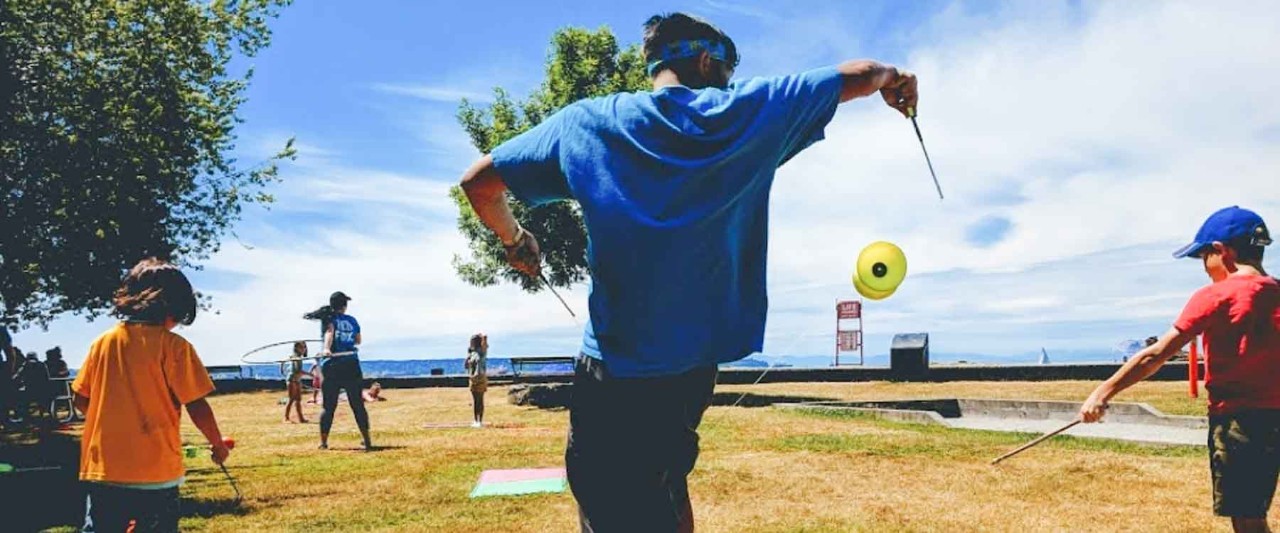 Volunteer playing with children outdoor