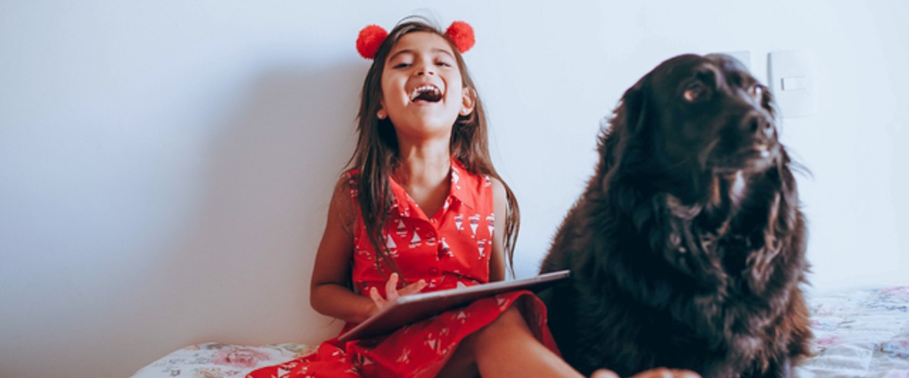 Girl posing with a dog