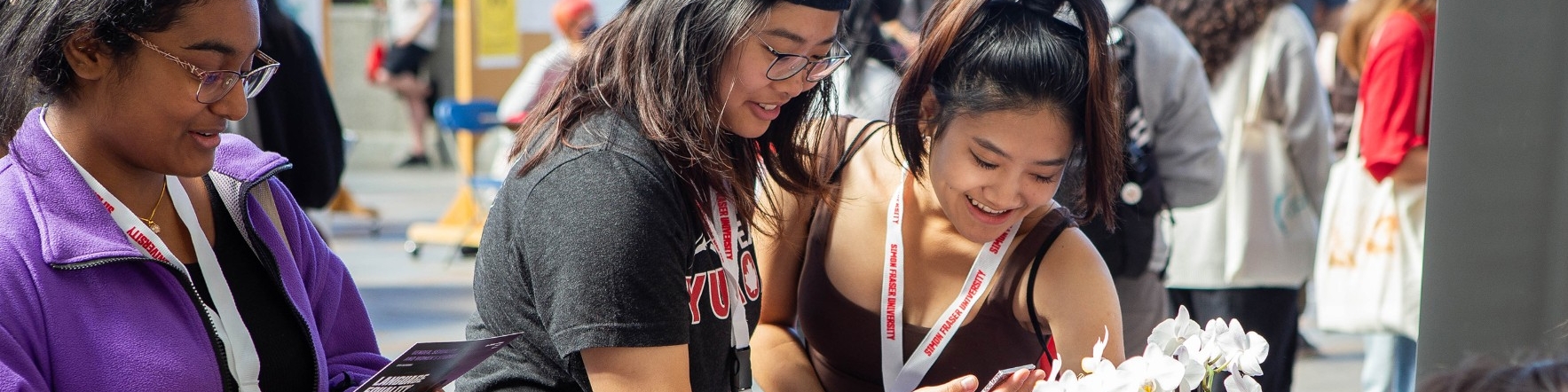 Students visiting the GSWS booth at an event