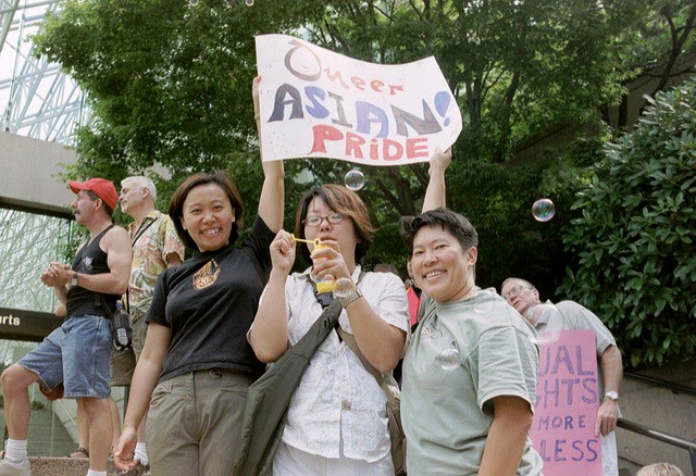 The author and two friends attending a 2003 rally for queer rights in Vancouver.