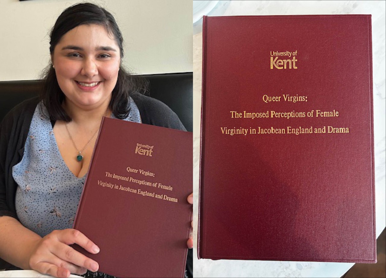 Emma Henderson holding her thesis