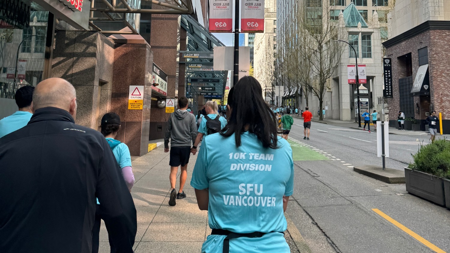 SFU Vancouver Sun Run members walking towards the start line