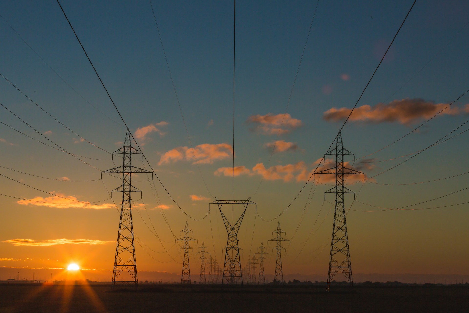 landscape view of powerlines in the sunset