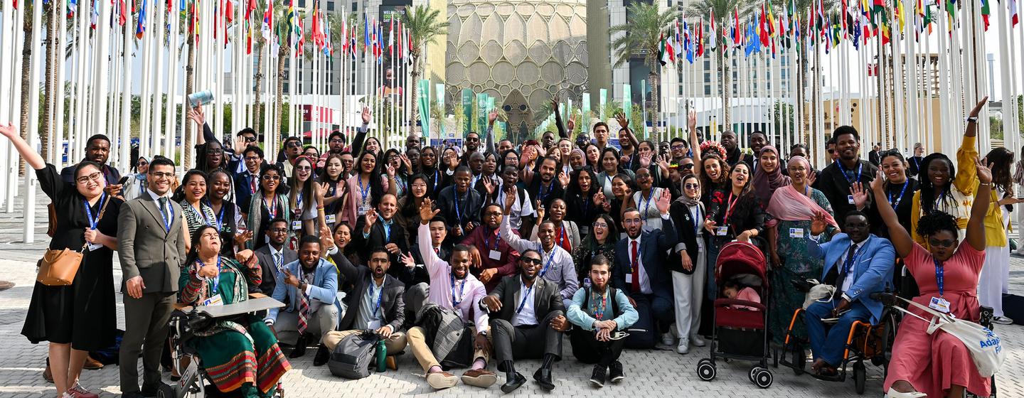 A group of people posing for an image at an international conference.