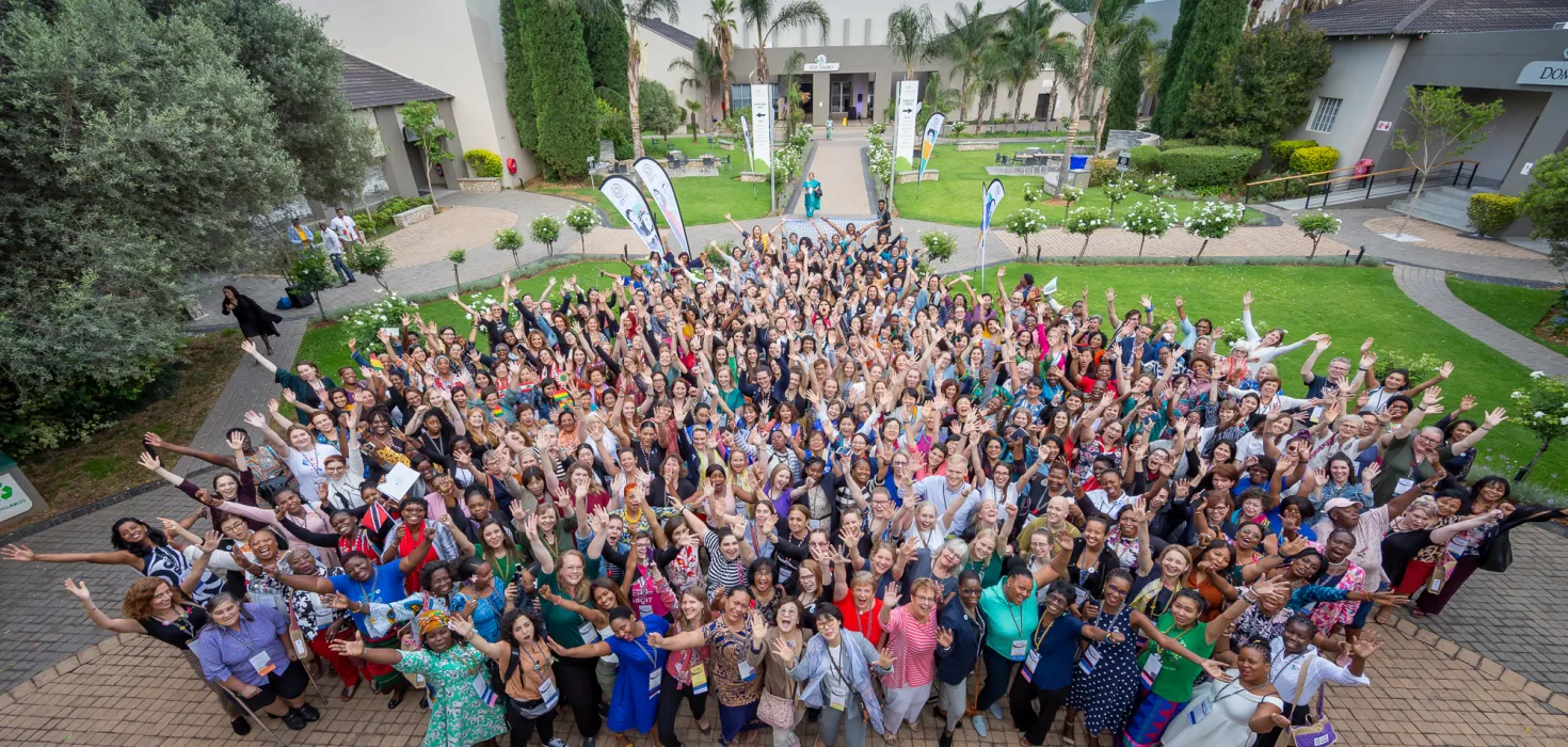 A large group of people posing for an image at a community gathering.