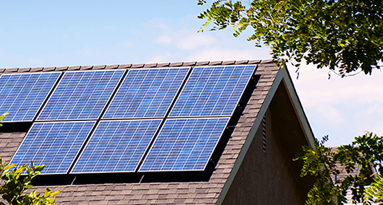 Solar panels atop the roof of a house