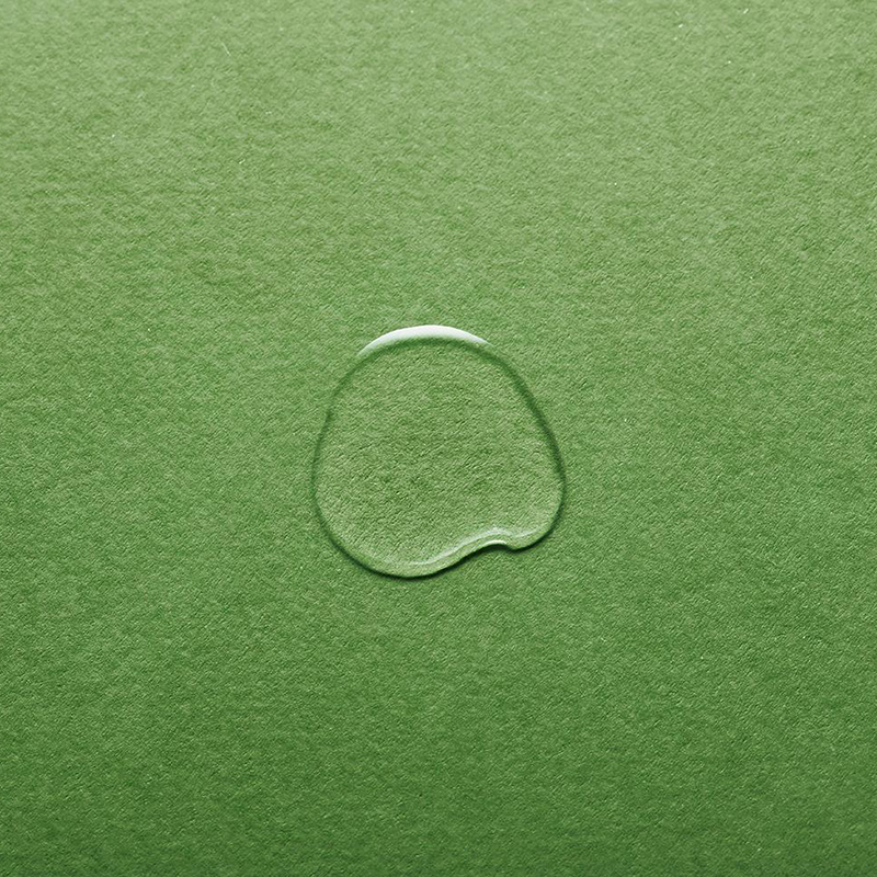 texture of Kale-Lalu-yAHA, a drop of Kale-Lalu-yAHA on a piece of green paper