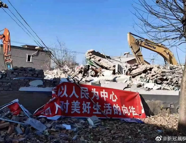 gallary post 1 with 5 images inside, cover image showing a ruin, a propaganda and an excavator