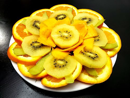 fruit platter with kiwi, mango, and orange