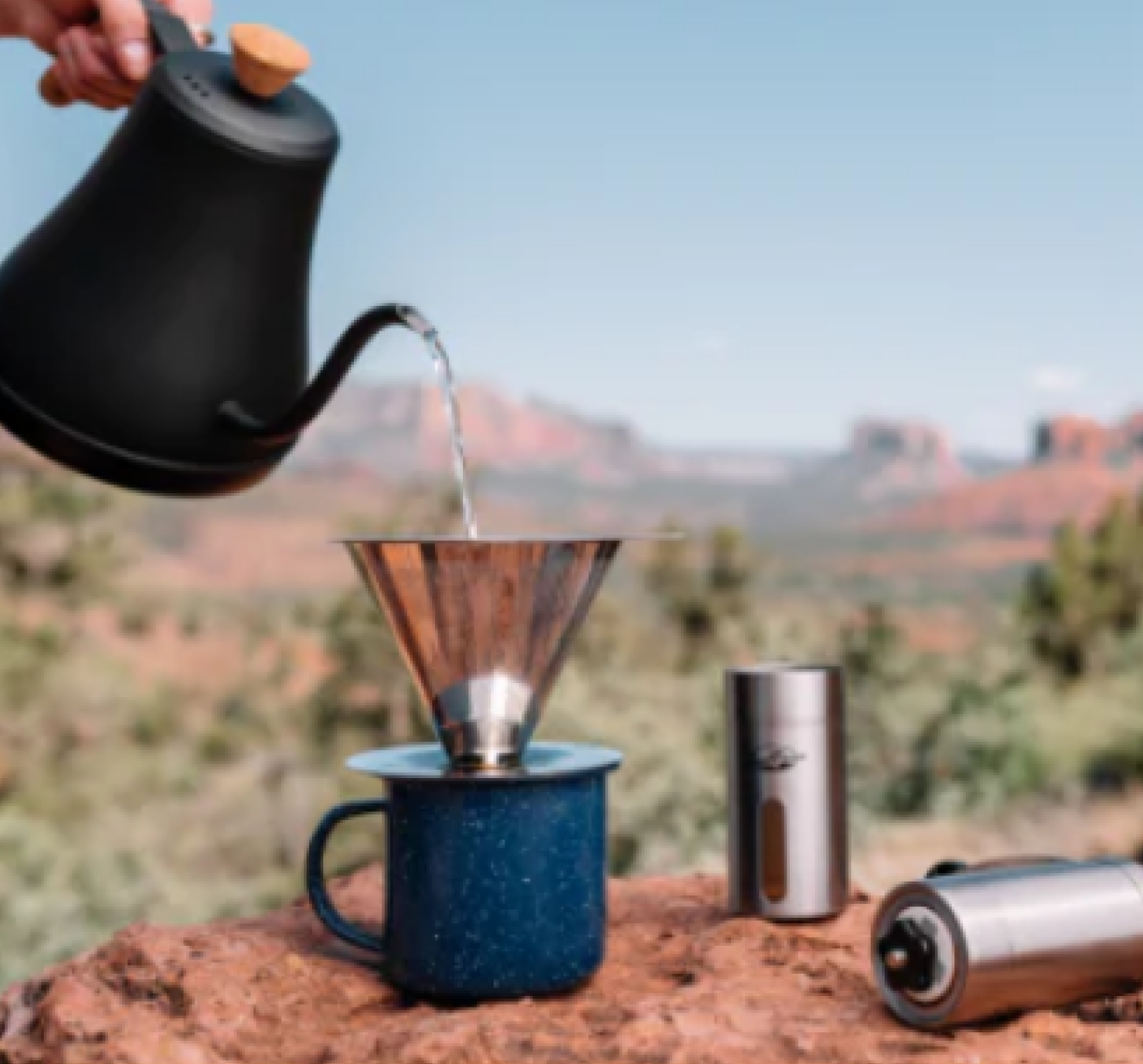 coffee being poured into cup in the outdoors