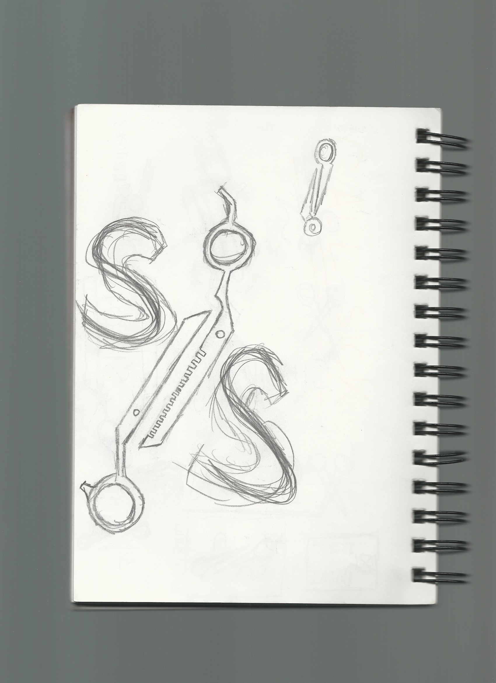 monogram scissor logo sketch with scissor teeth