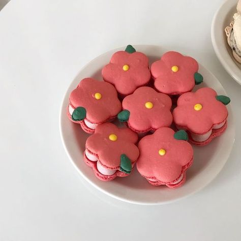 plate of pink flower macarons