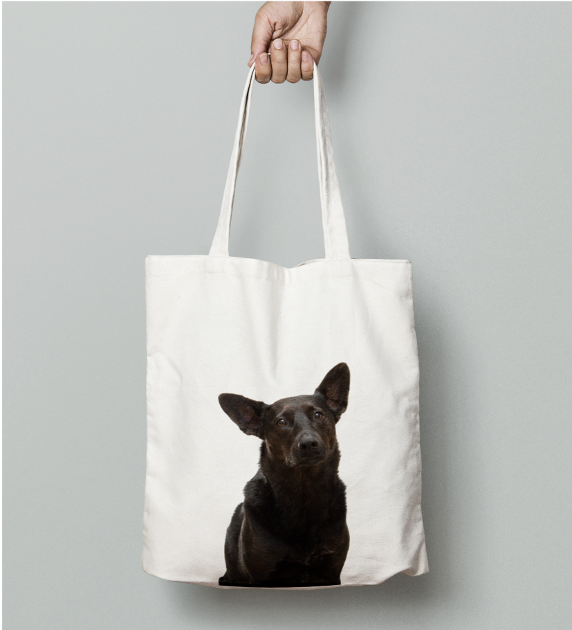 Tote bag with a black dog printed.