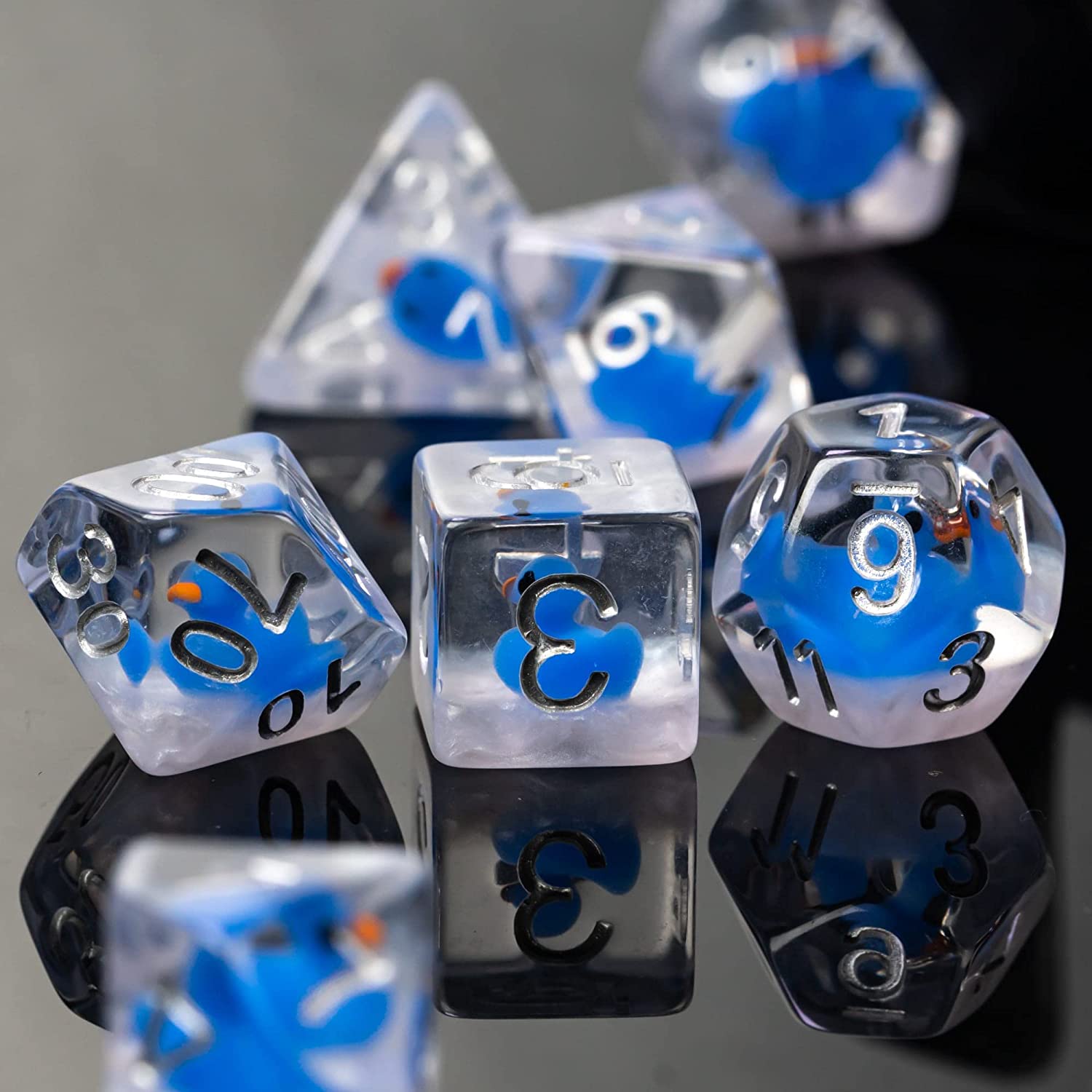 7 duck dice on a black surface