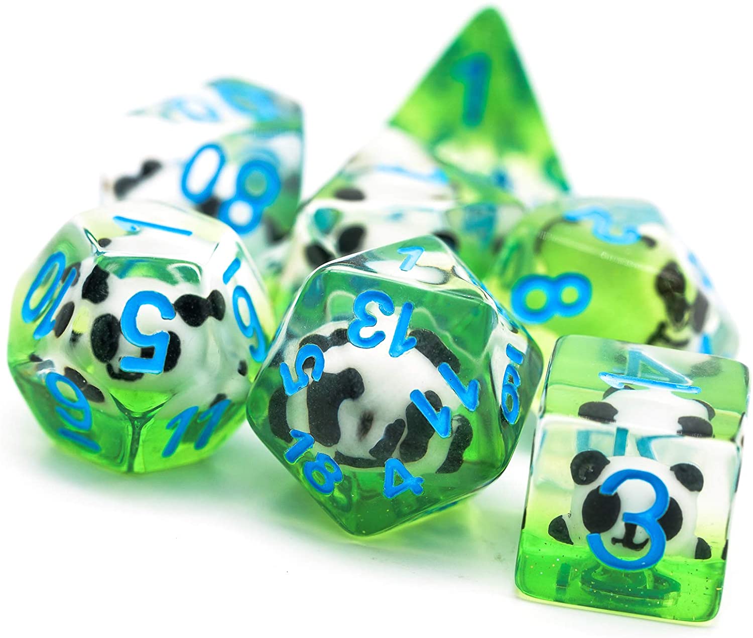 7 Translucent resin dice with a panda figure inside lay flat