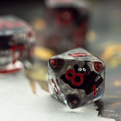 A D20 translucent bat resin dice, showing a number 8