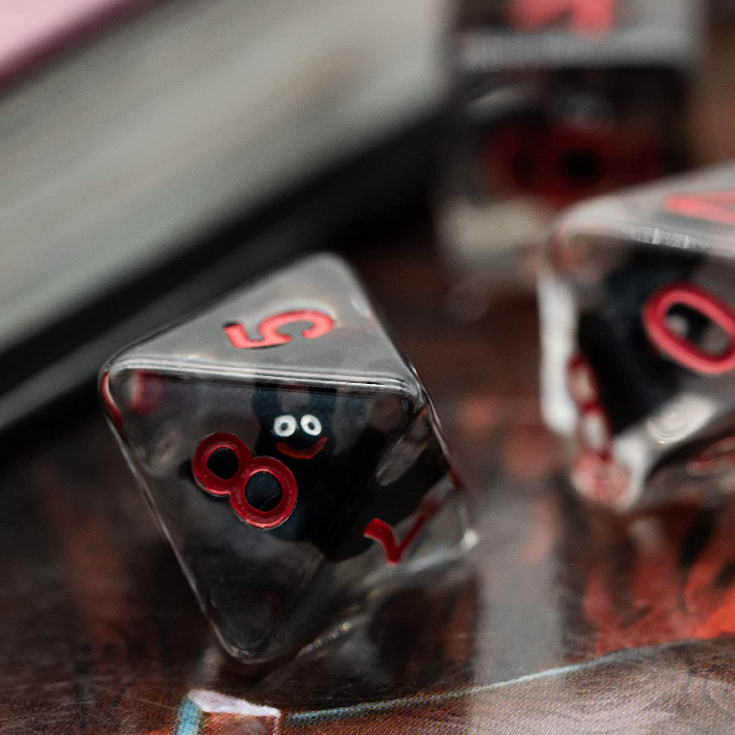 A D8 translucent bat resin dice, showing a number 8