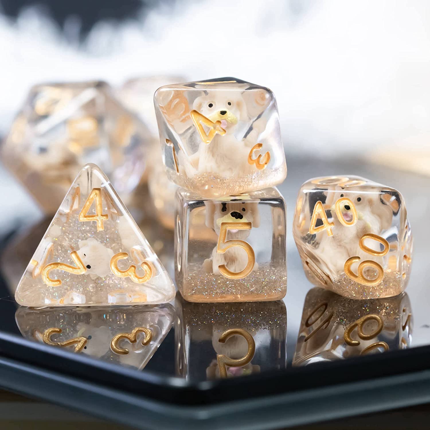 Dog dice, stacked on top of each other on a black surface