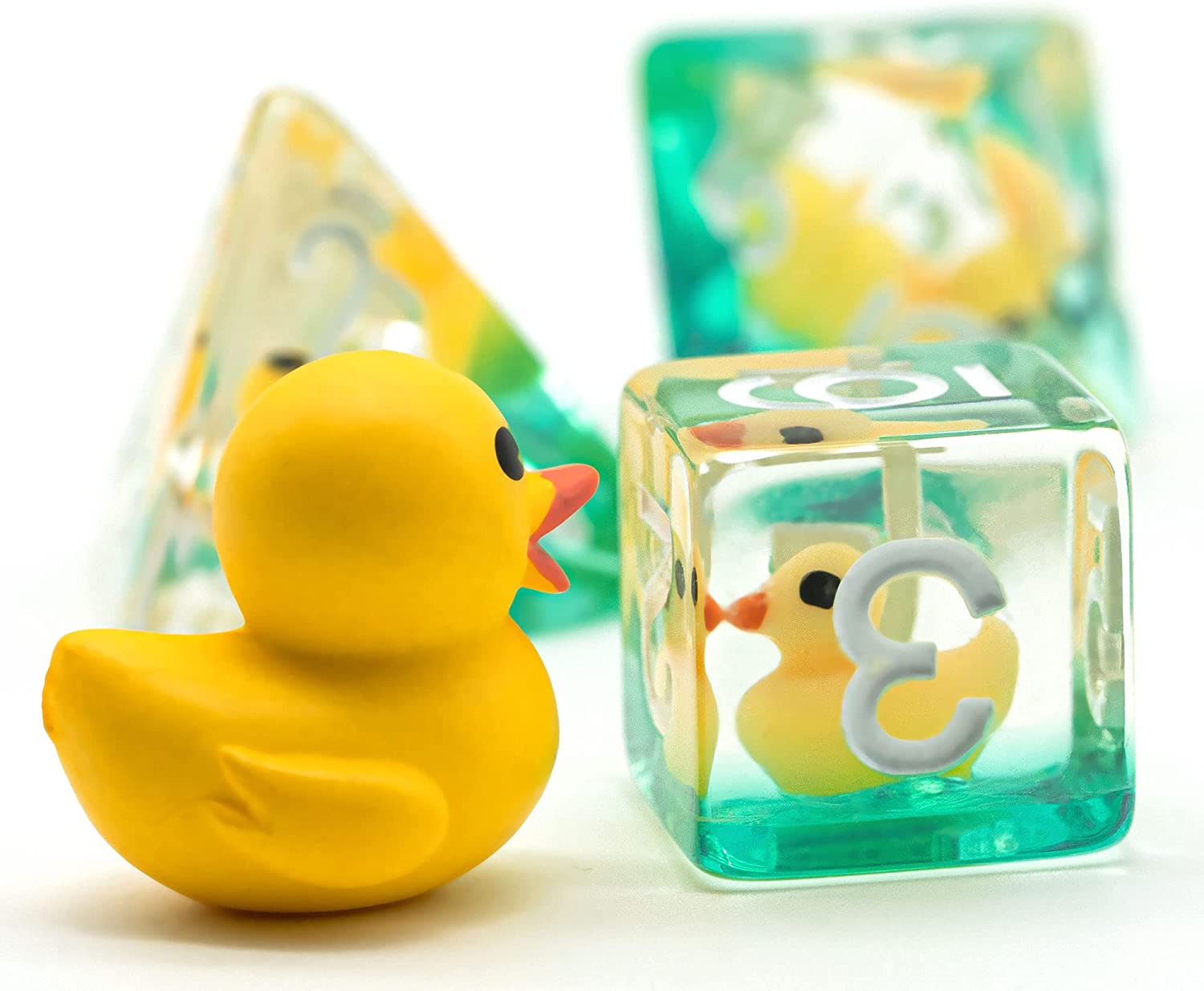 Translucent resin dice with yellow ducks inside