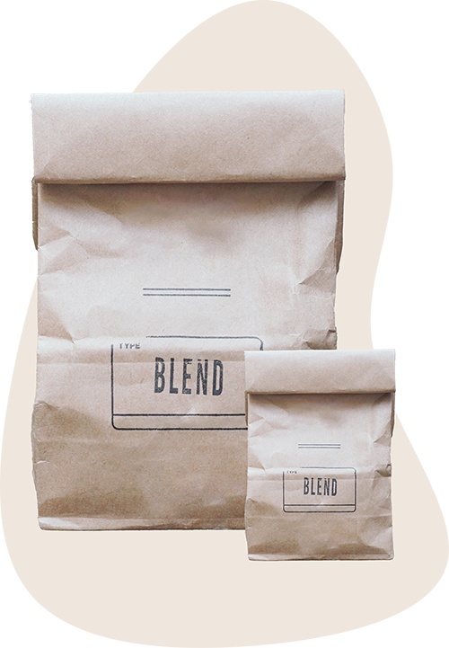Two brown paper bags of soil with the word blend on it