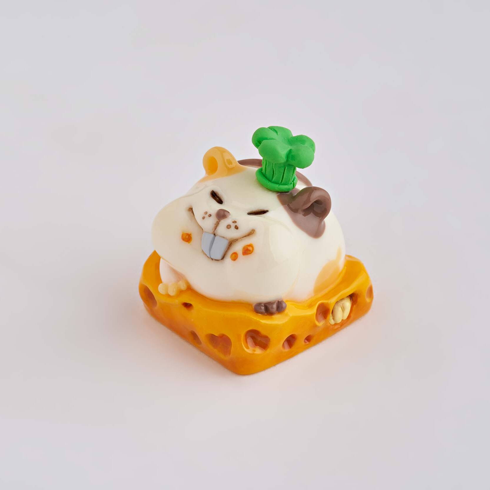 artisan keycap of cute white spotted mouse sitting on cheese