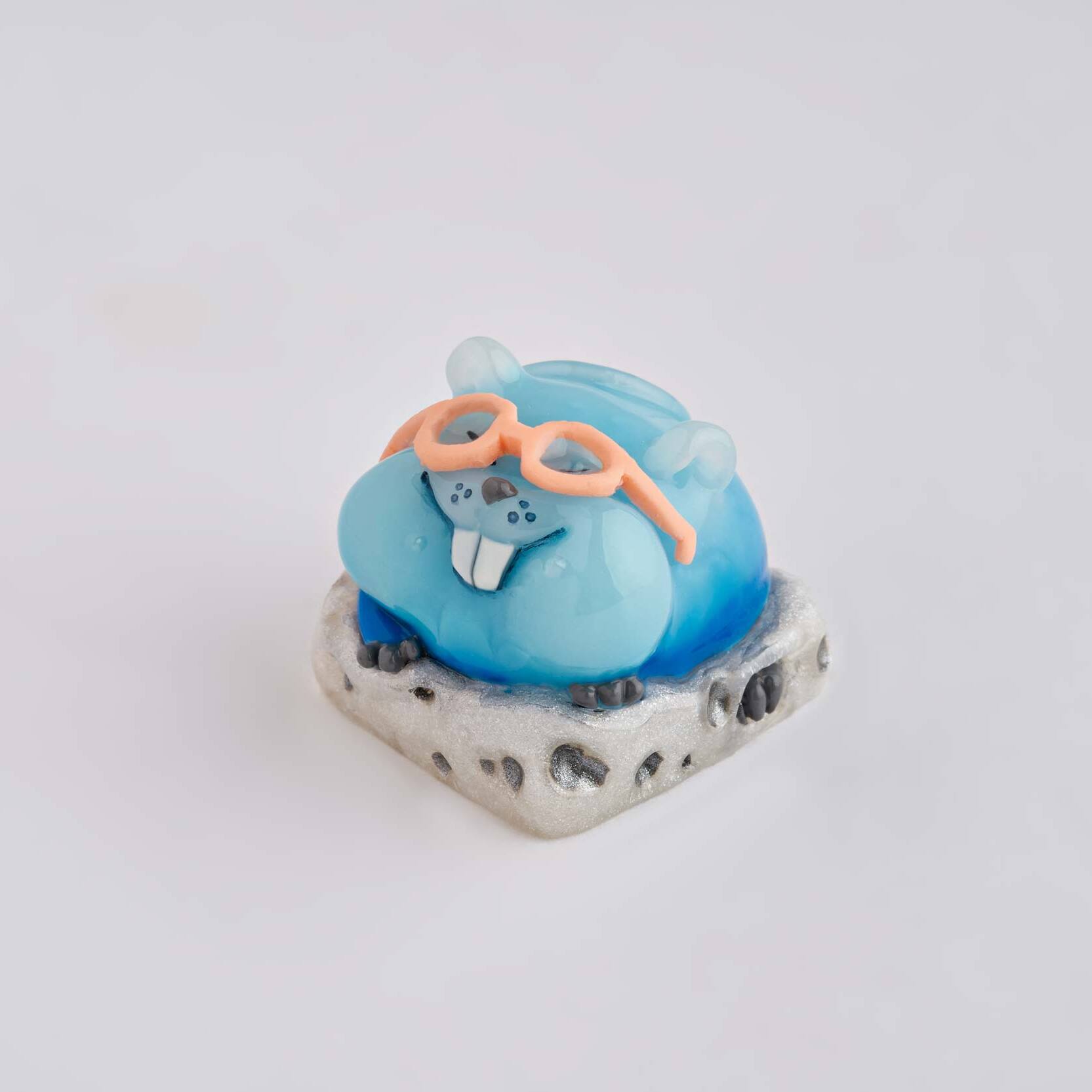 artisan keycap of cute blue mouse sitting on white cheese