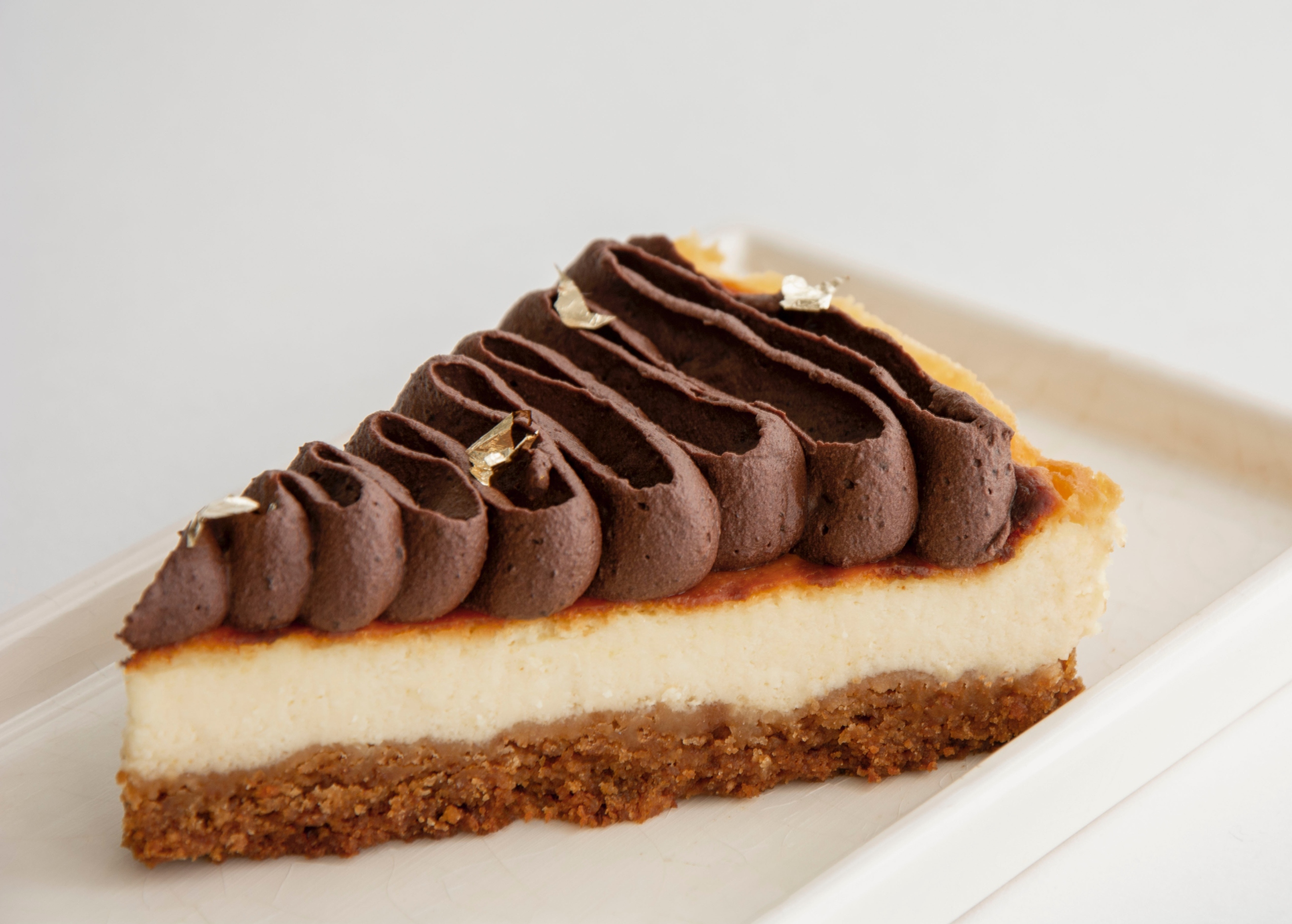 A slice of a chocolate cheesecake