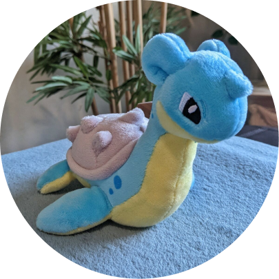 Review image of Sitting Cuties Lapras plush sitting on a blue carpet