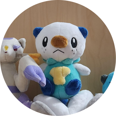 Review image of Sitting Cuties Manaphy plush sitting against a brown background