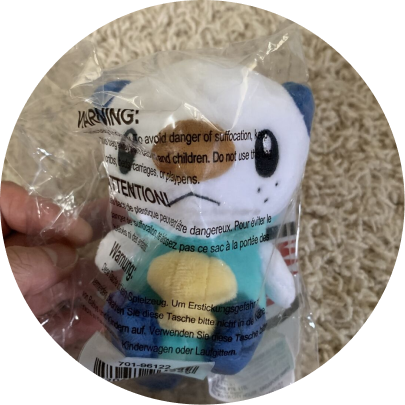 Review image of Sitting Cuties Oshawott plush on carpet in plastic