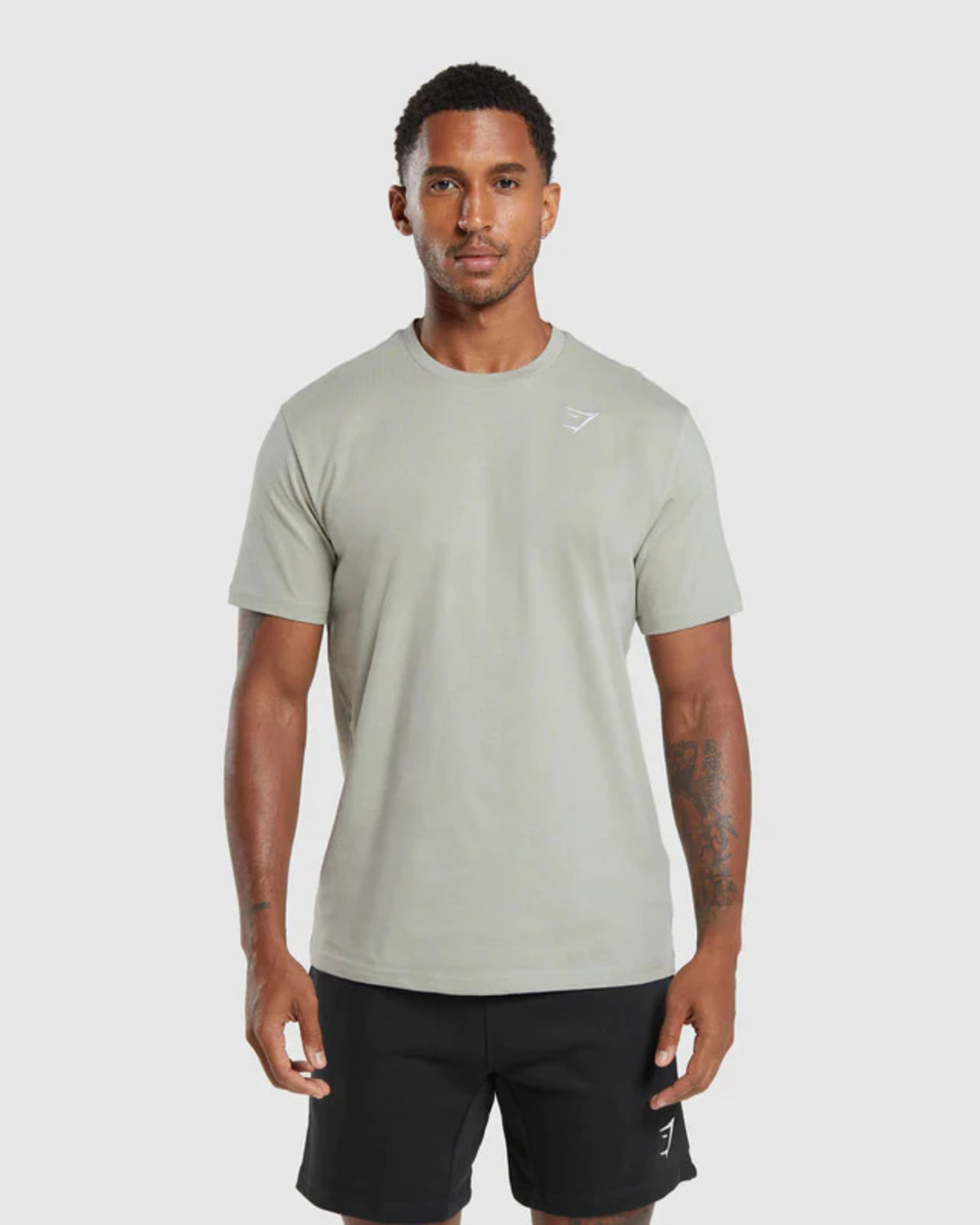 Male model in Hollingsworth green t-shirt. link to product page.