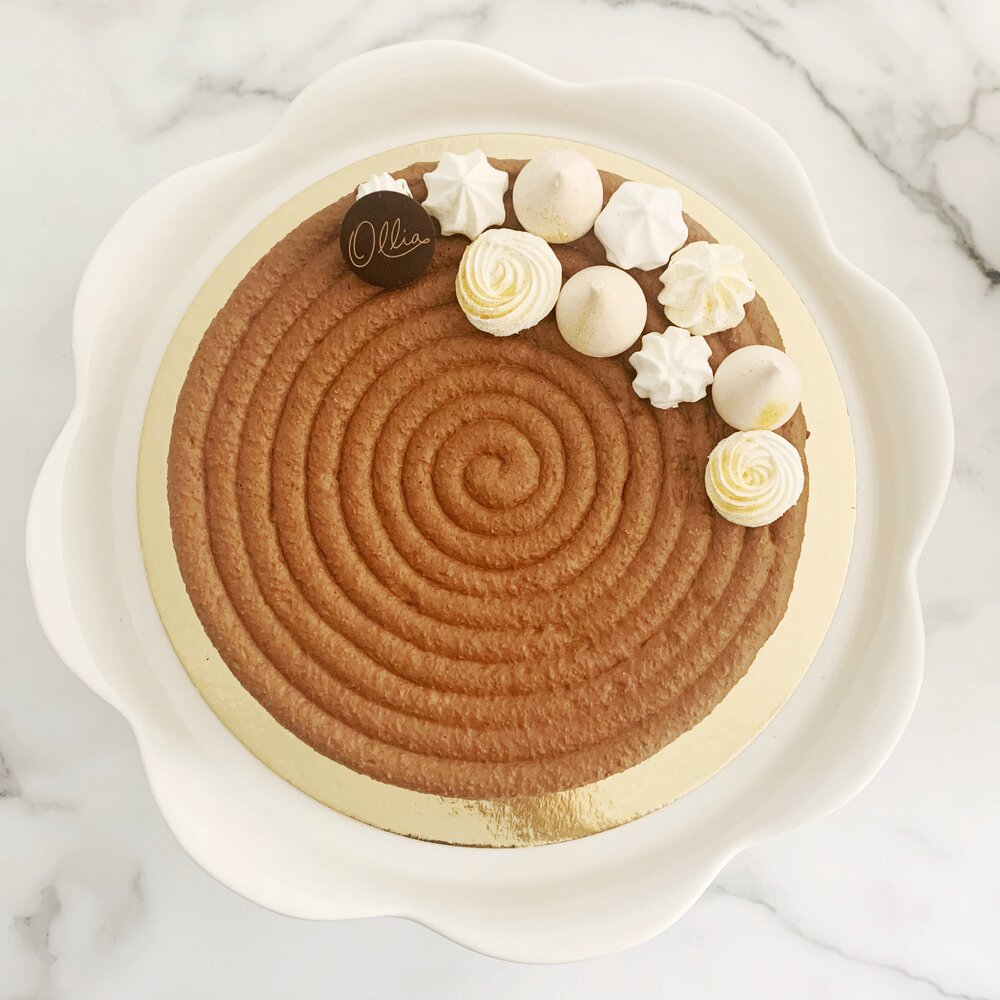 A picture of a brown macaron cake.