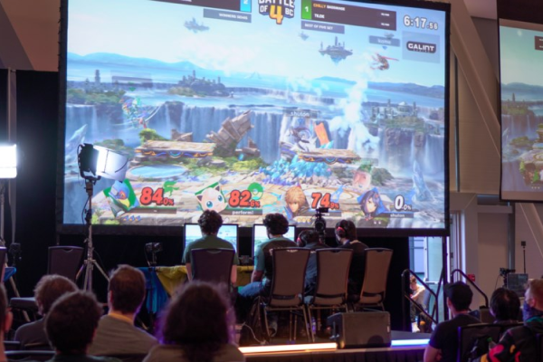 People playing Super Smash Bros on stage