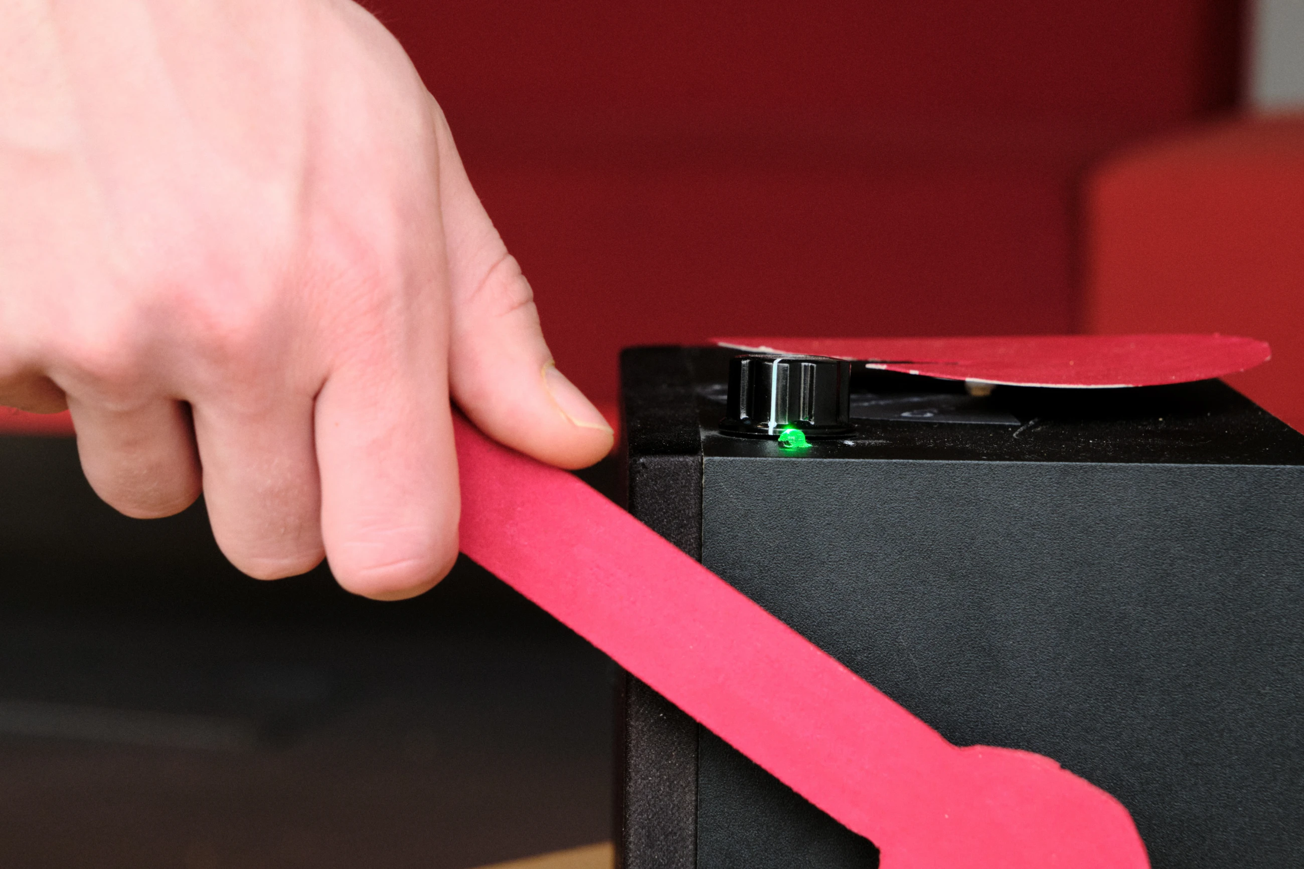 Person turning lever on a black box