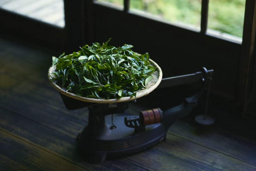 a bamboo tray of tea leaves