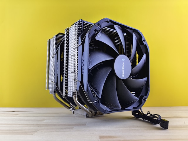 A computer fan on a wooden table