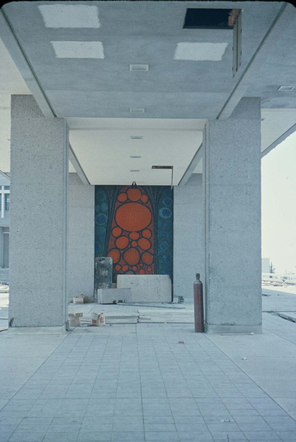 SFU concrete building with a red and blue painting