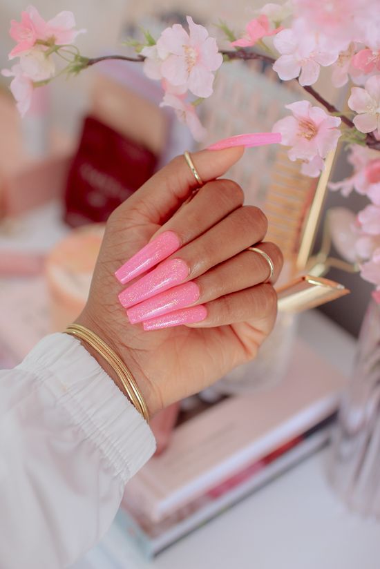 hand with pink nails for about us