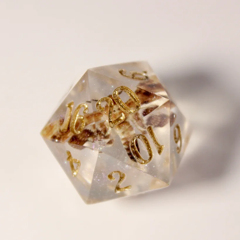 A single insect die with gold numbers