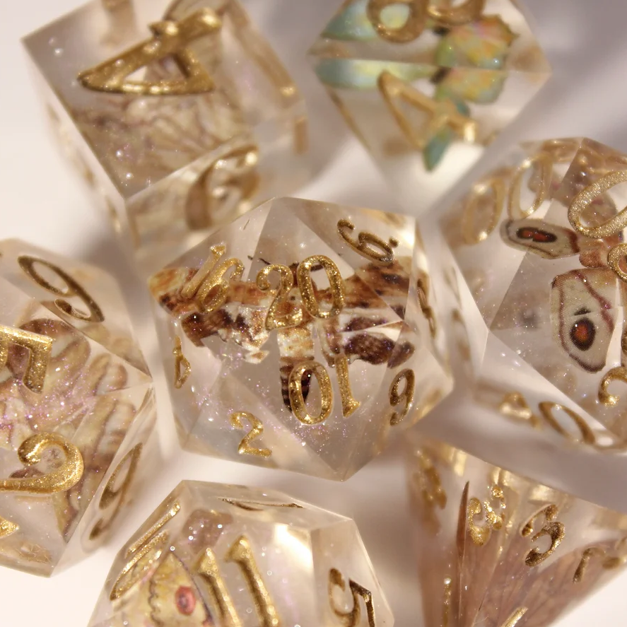 A set of insect dice with gold numbers