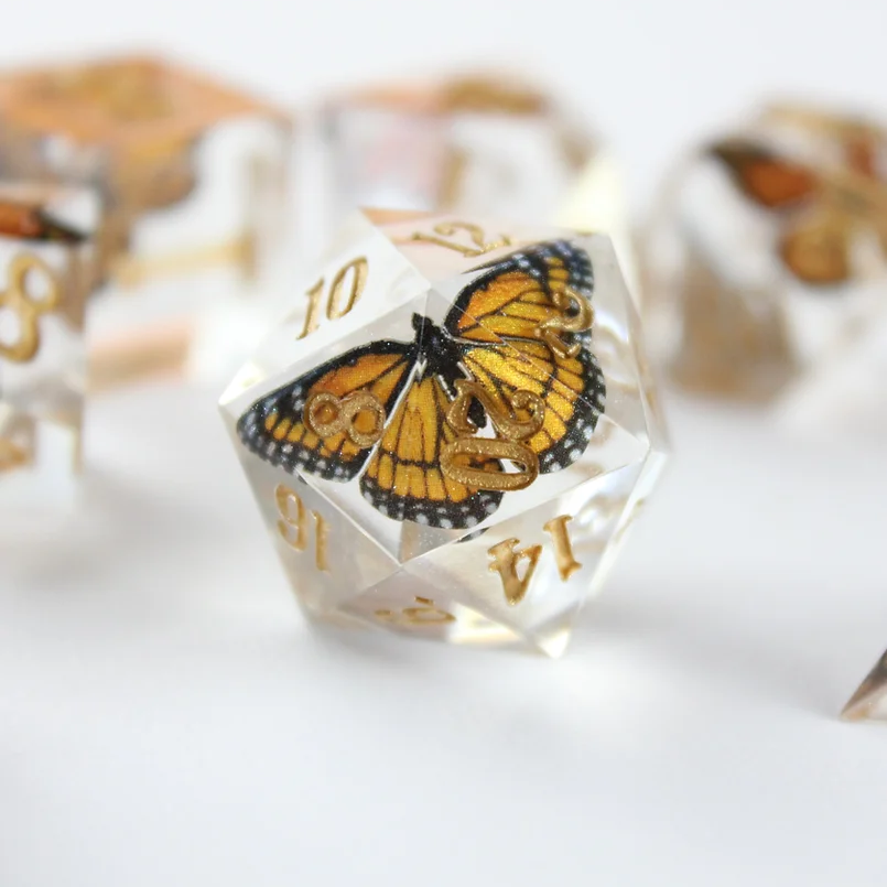 A single monarch butterfly die with gold numbers