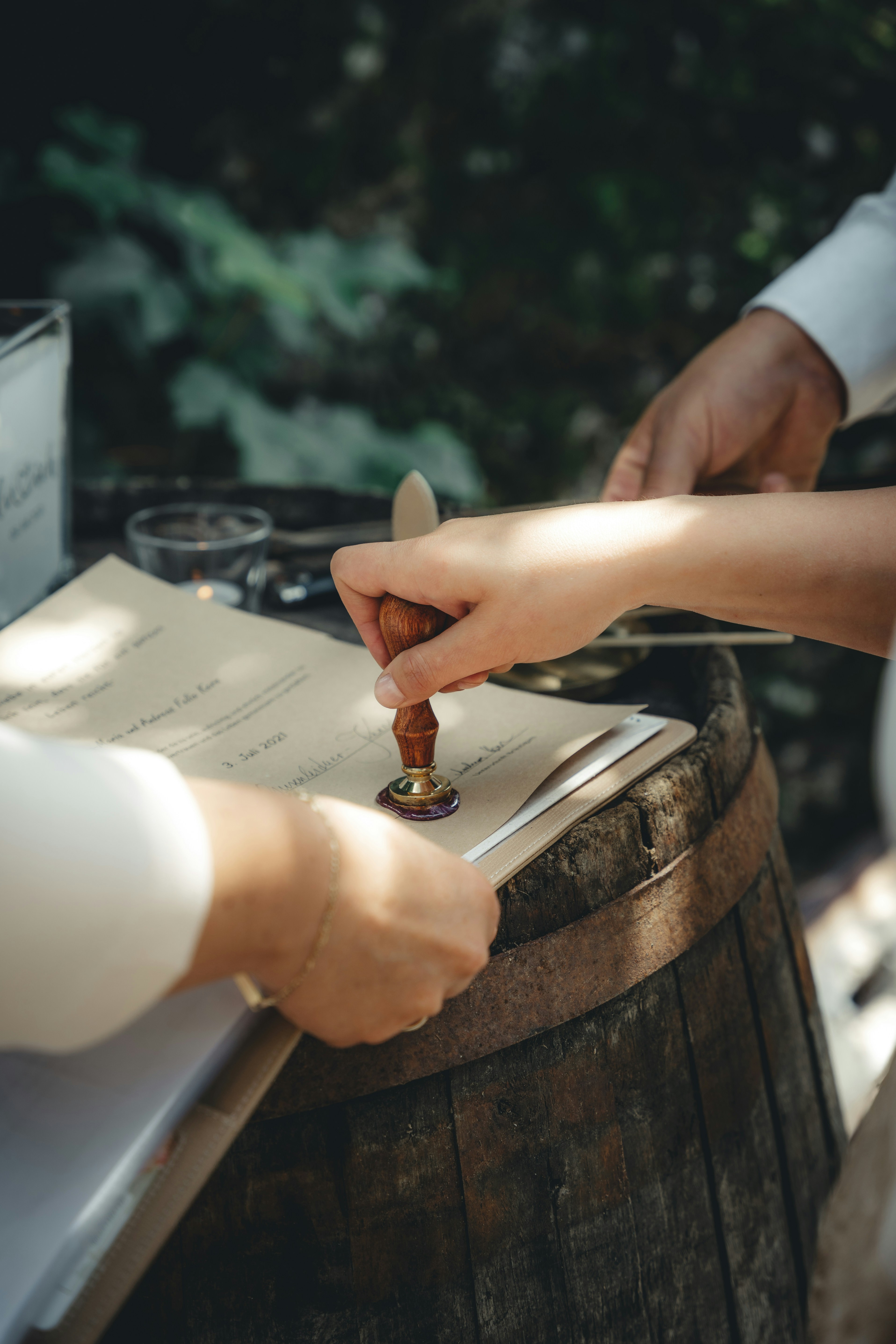 a hand pressing on the seal